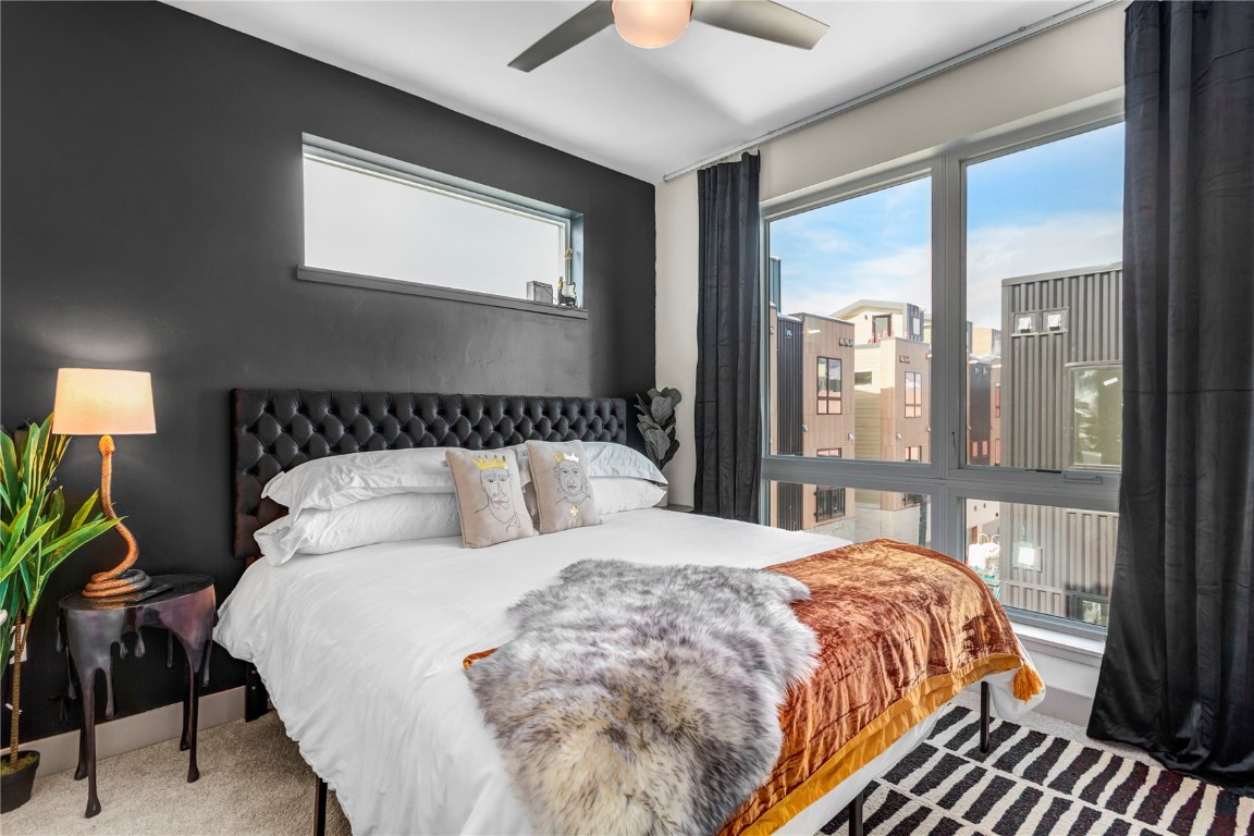 58 3rd Street, Unit D Silverthorne, CO 80498 - Photo 14 of 29 a bedroom with a large bed and a large window