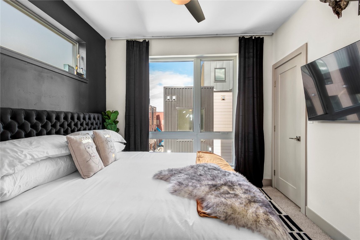 58 3rd Street, Unit D Silverthorne, CO 80498 - Photo 15 of 29 a bedroom with a large bed and a window