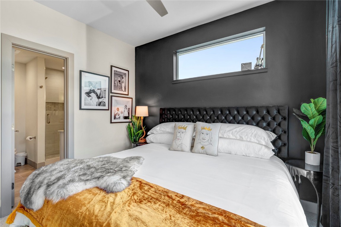 58 3rd Street, Unit D Silverthorne, CO 80498 - Photo 17 of 29 a bedroom with bed and painting on the wall