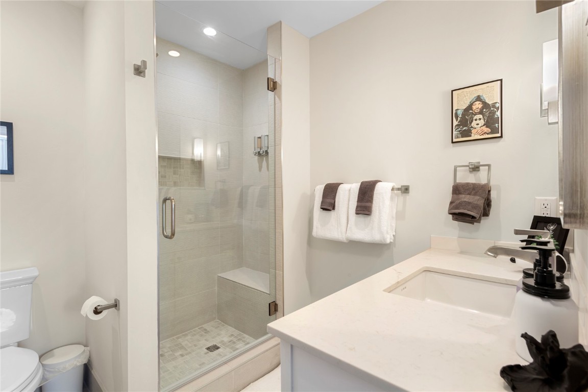 58 3rd Street, Unit D Silverthorne, CO 80498 - Photo 20 of 29 a bathroom with a sink a toilet and shower