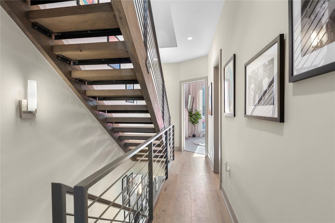 58 3rd Street, Unit D Silverthorne, CO 80498 - Photo 25 of 29 a view of a hallway with wooden floor and staircase