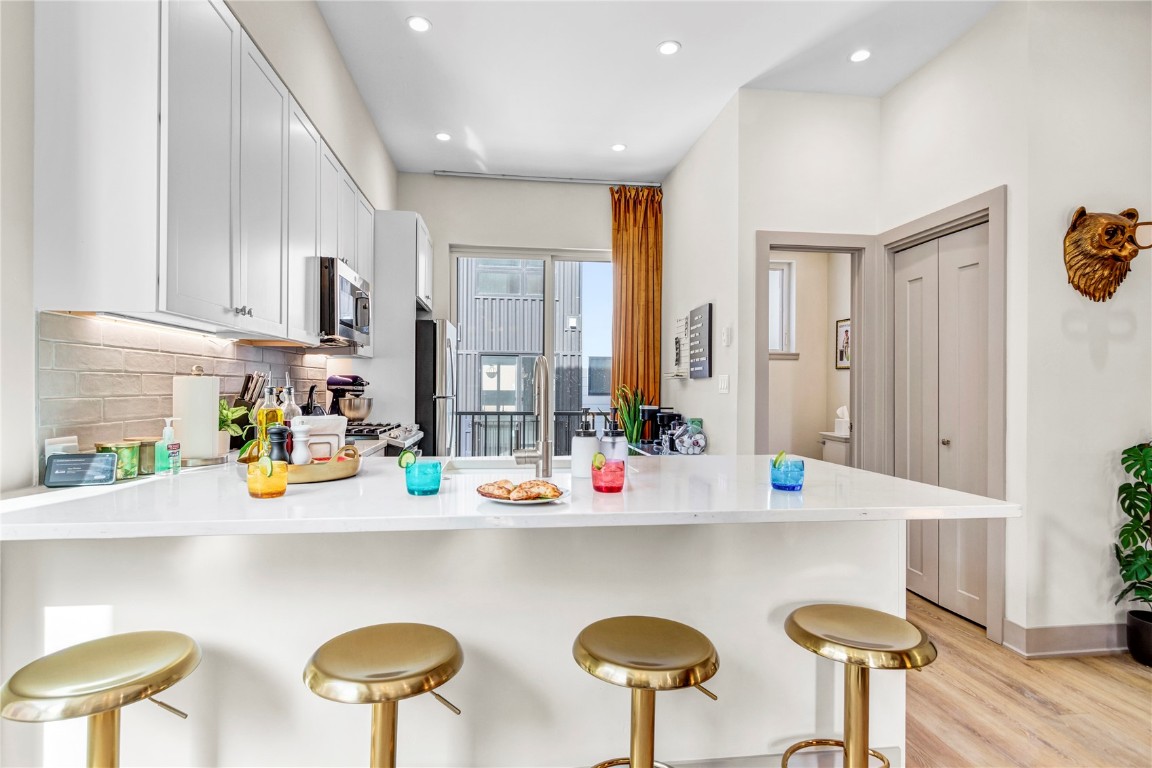 58 3rd Street, Unit D Silverthorne, CO 80498 - Photo 6 of 29 a kitchen with furniture and a refrigerator