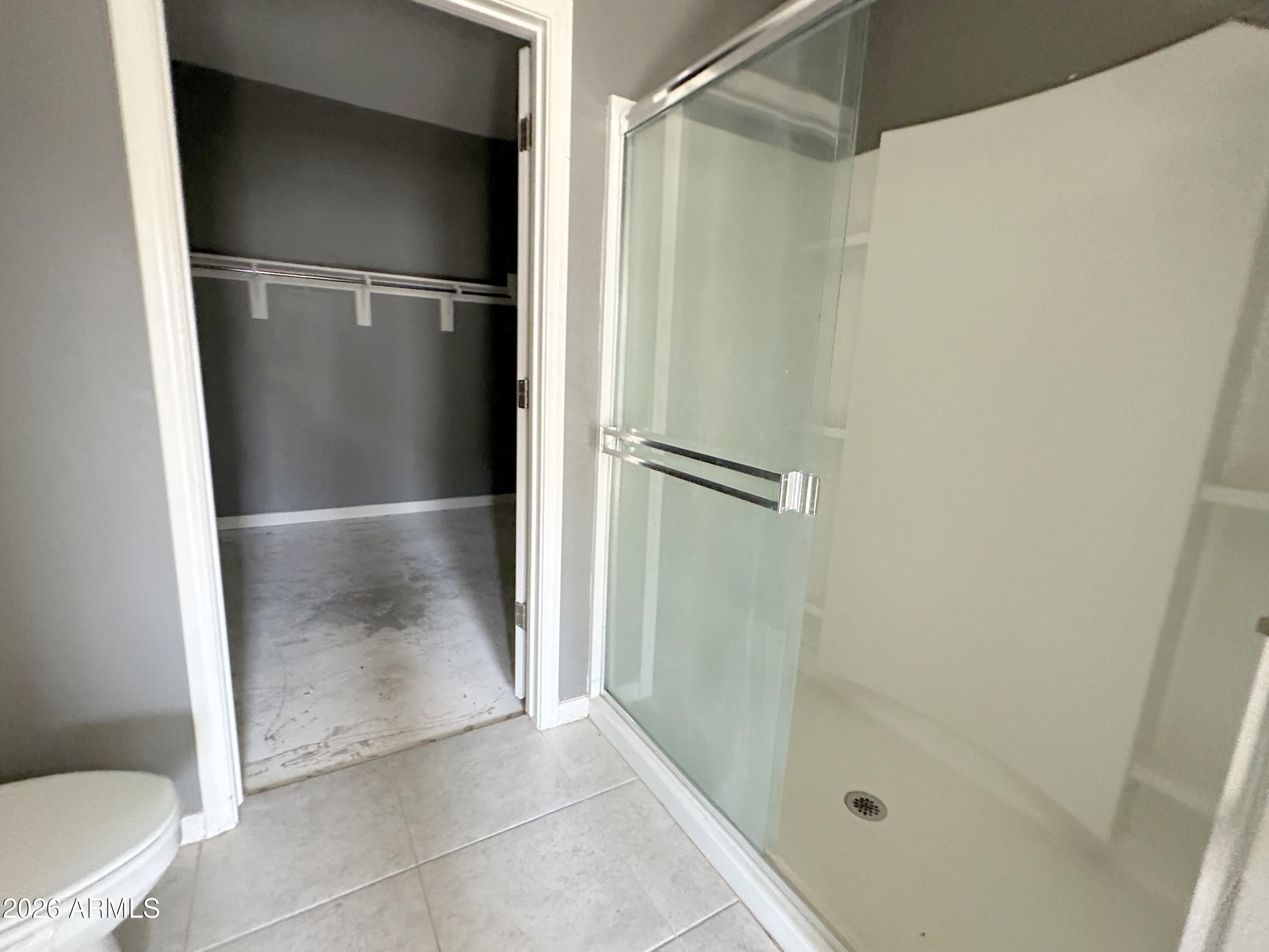 6085 East Athena Road Florence, AZ 85132 - Photo 12 of 21 a bathroom with a glass shower door