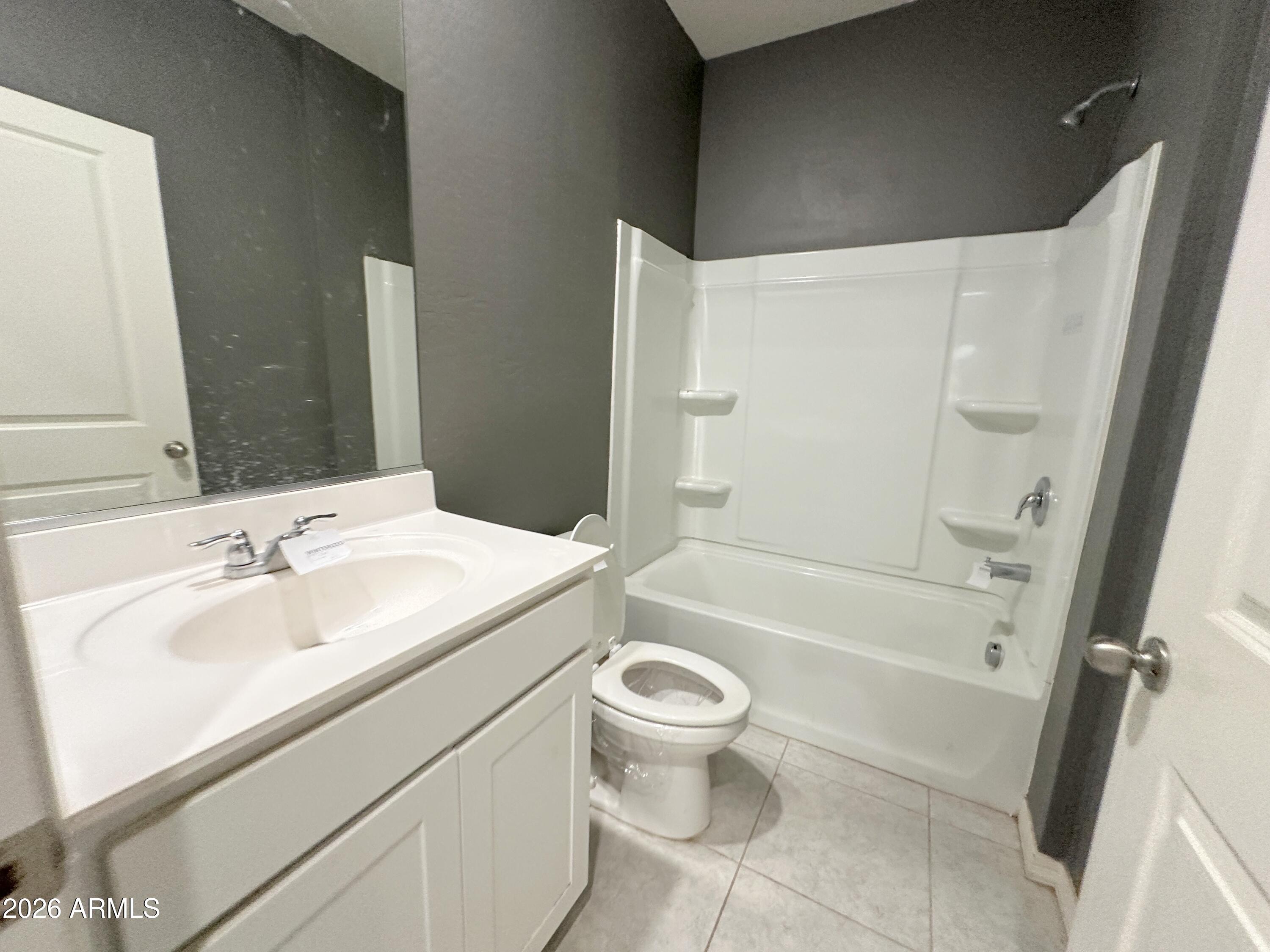6085 East Athena Road Florence, AZ 85132 - Photo 14 of 21 a bathroom with a sink a toilet and shower