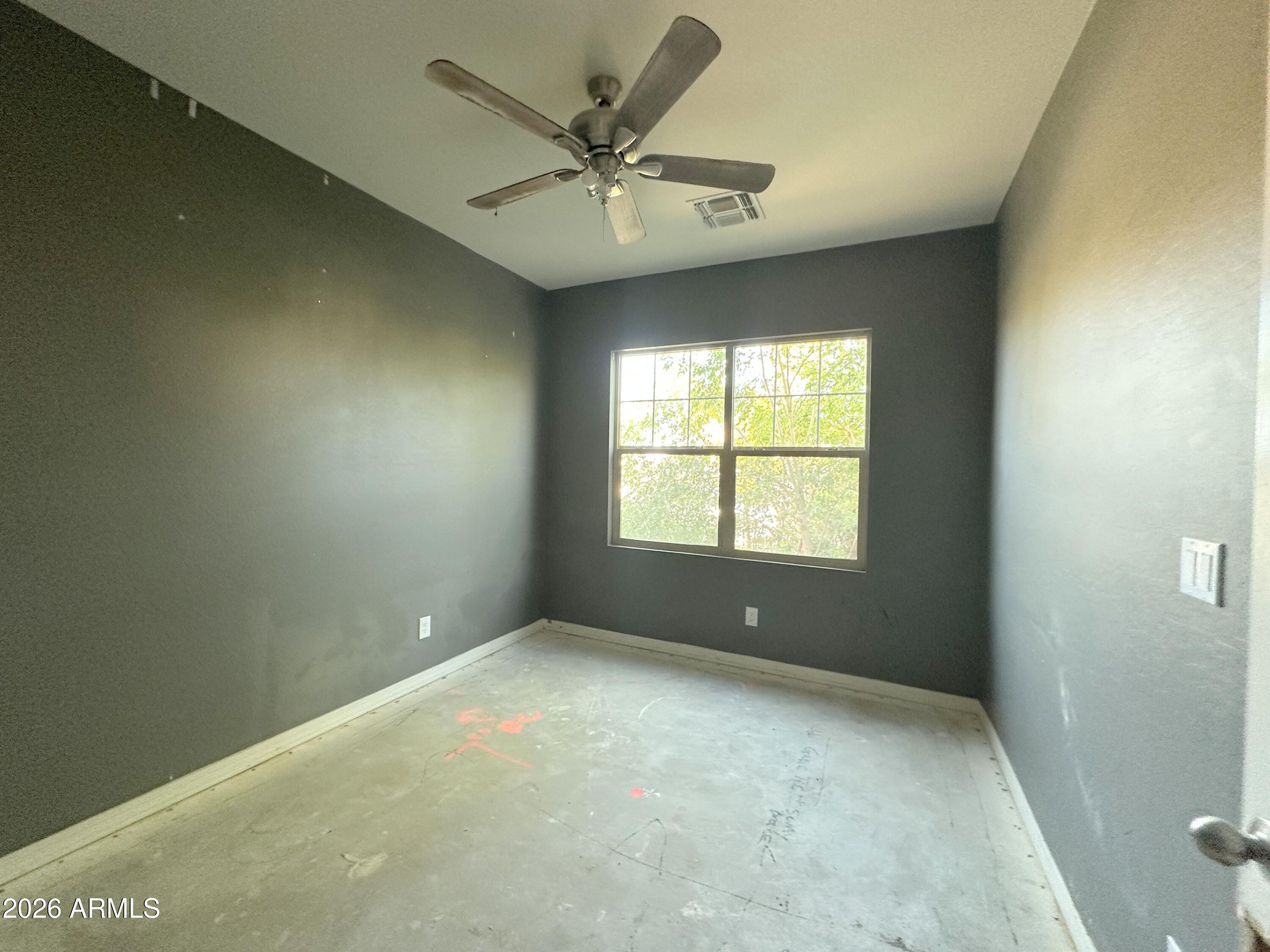 6085 East Athena Road Florence, AZ 85132 - Photo 2 of 21 a view of an empty room with a window