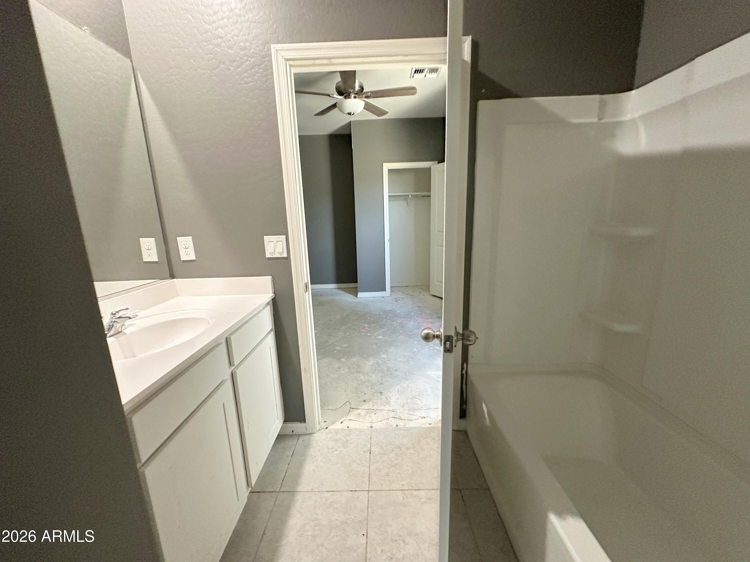 6085 East Athena Road Florence, AZ 85132 - Photo 5 of 21 a bathroom with a sink and mirror