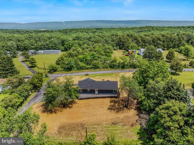 a view of a lake with a yard