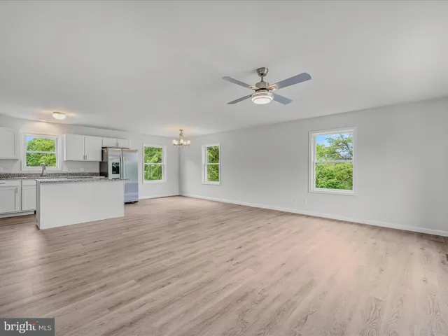 a view of a kitchen with a sink and a window