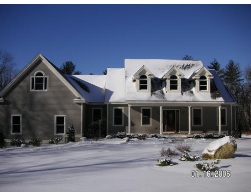 68 Peach Hill Road Berlin, MA 01503 - Photo 1 of 14 a front view of a house with a yard