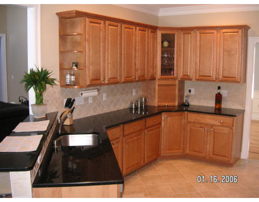 68 Peach Hill Road Berlin, MA 01503 - Photo 4 of 14 a kitchen with stainless steel appliances granite countertop a sink a stove and a microwave