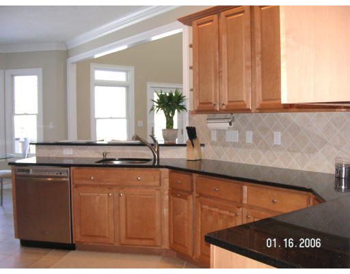 68 Peach Hill Road Berlin, MA 01503 - Photo 5 of 14 a kitchen with stainless steel appliances granite countertop a sink a stove and a microwave