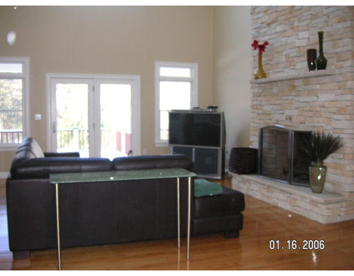68 Peach Hill Road Berlin, MA 01503 - Photo 8 of 14 a kitchen with a table chairs and a fireplace