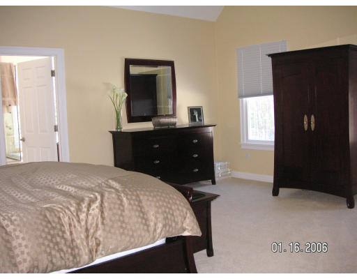 68 Peach Hill Road Berlin, MA 01503 - Photo 10 of 14 a bedroom with a bed and a mirror