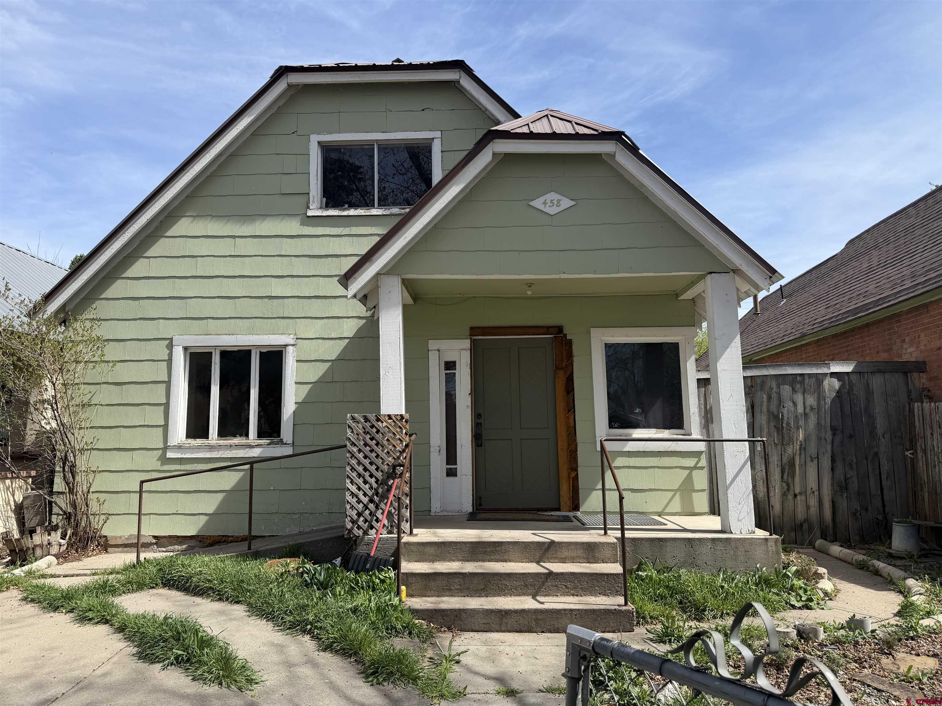 458 East 4th Avenue Durango, CO 81301 - Photo 1 of 13 a front view of a house with a yard