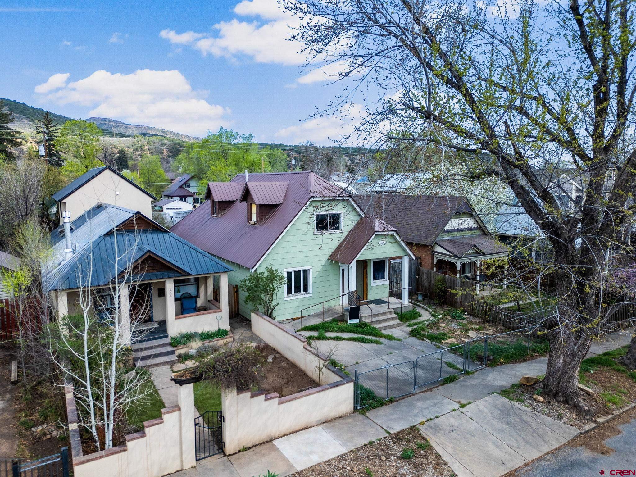 458 East 4th Avenue Durango, CO 81301 - Photo 3 of 13 a front view of a house with garden