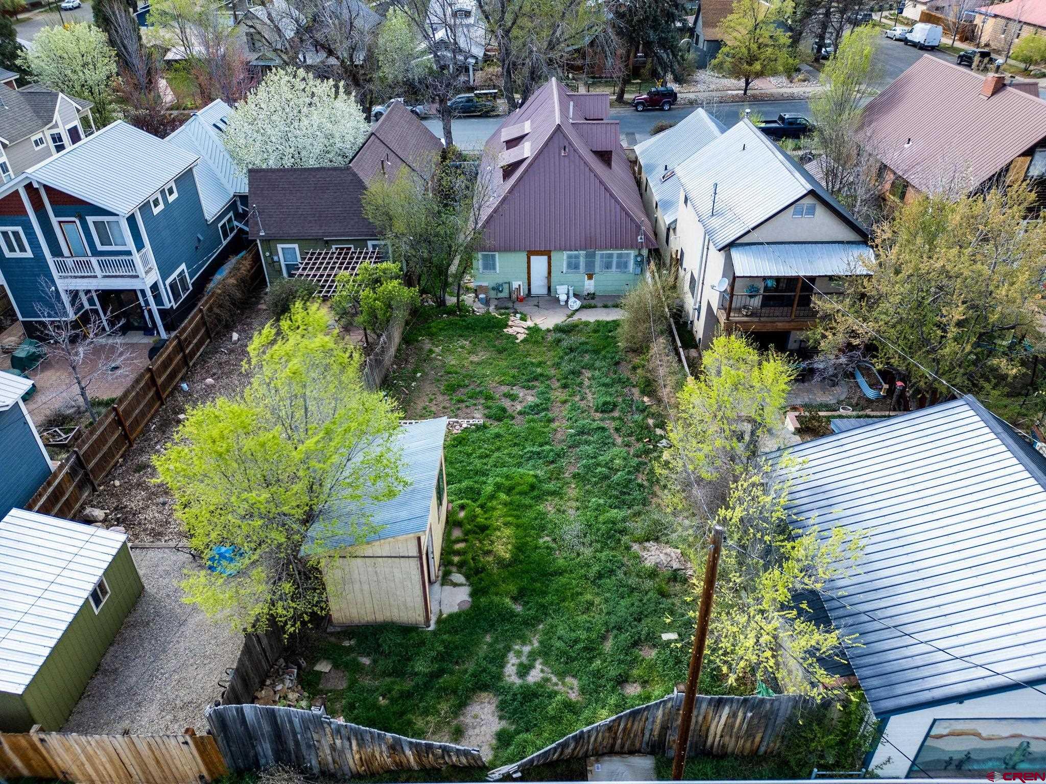 458 East 4th Avenue Durango, CO 81301 - Photo 9 of 13 a aerial view of a house with table and chairs under an umbrella