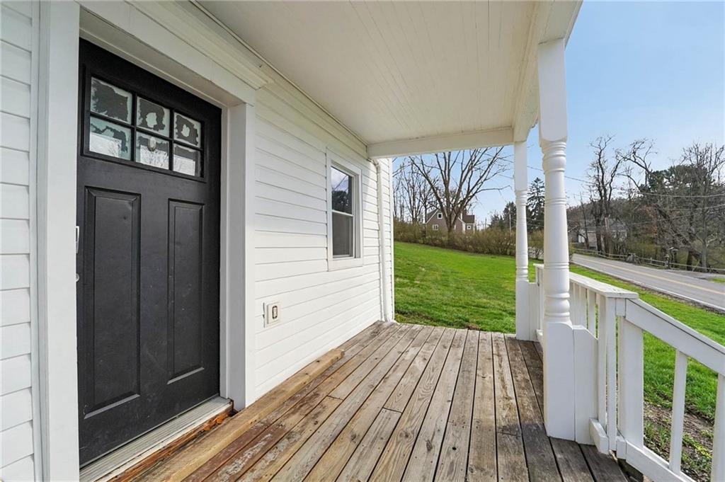 6012 Cunningham Road Gibsonia, PA 15044 - Photo 2 of 26 a view of a porch with wooden floor and fence