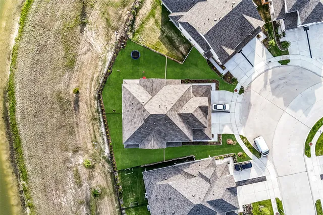 an aerial view of a house with a garden