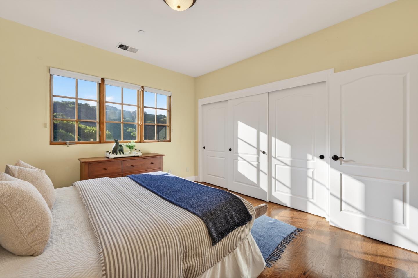 17599 Montebello Road Cupertino, CA 95014 - Photo 44 of 83 a bedroom with a large bed and a window