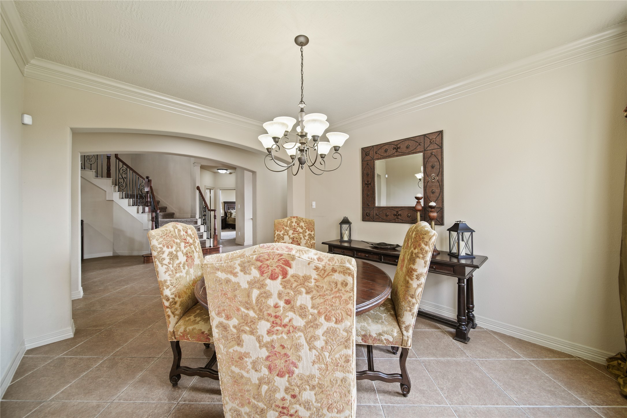 3414 Rue Orleans Missouri City, TX 77459 - Photo 11 of 46 a view of a dining room with furniture and chandelier