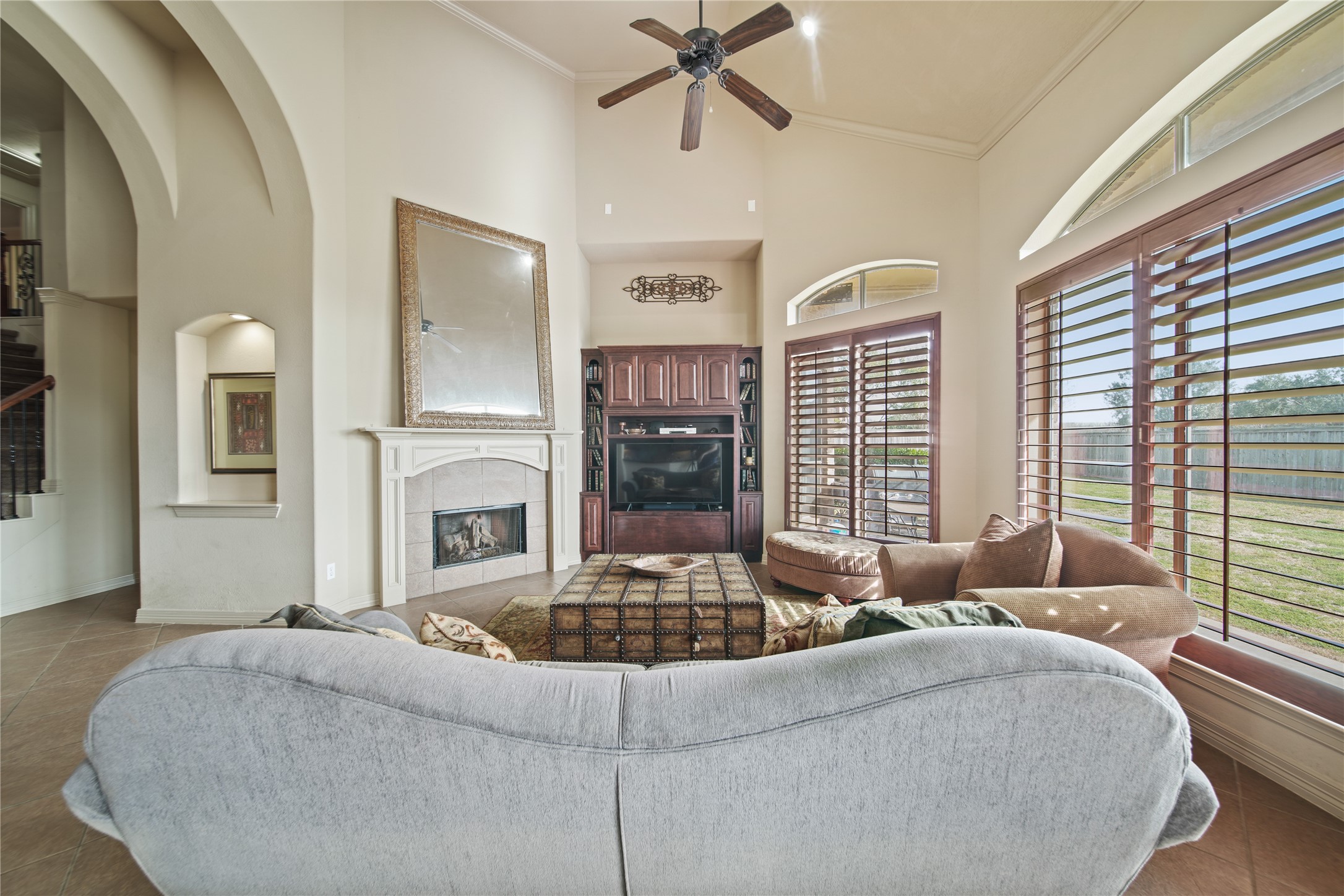 3414 Rue Orleans Missouri City, TX 77459 - Photo 16 of 46 a living room with fireplace furniture and a large window