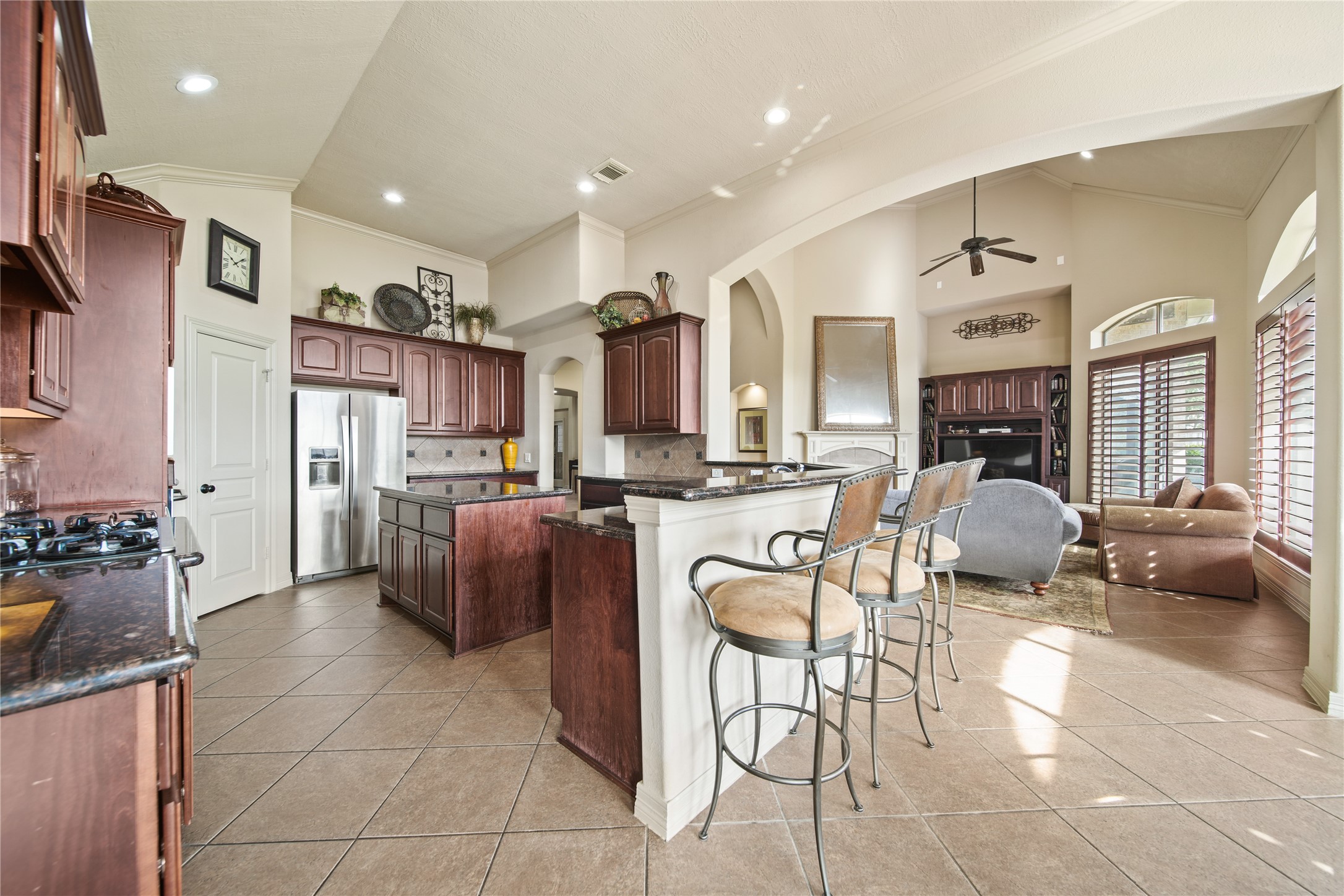 3414 Rue Orleans Missouri City, TX 77459 - Photo 17 of 46 a living room filled with furniture a chandelier and kitchen view