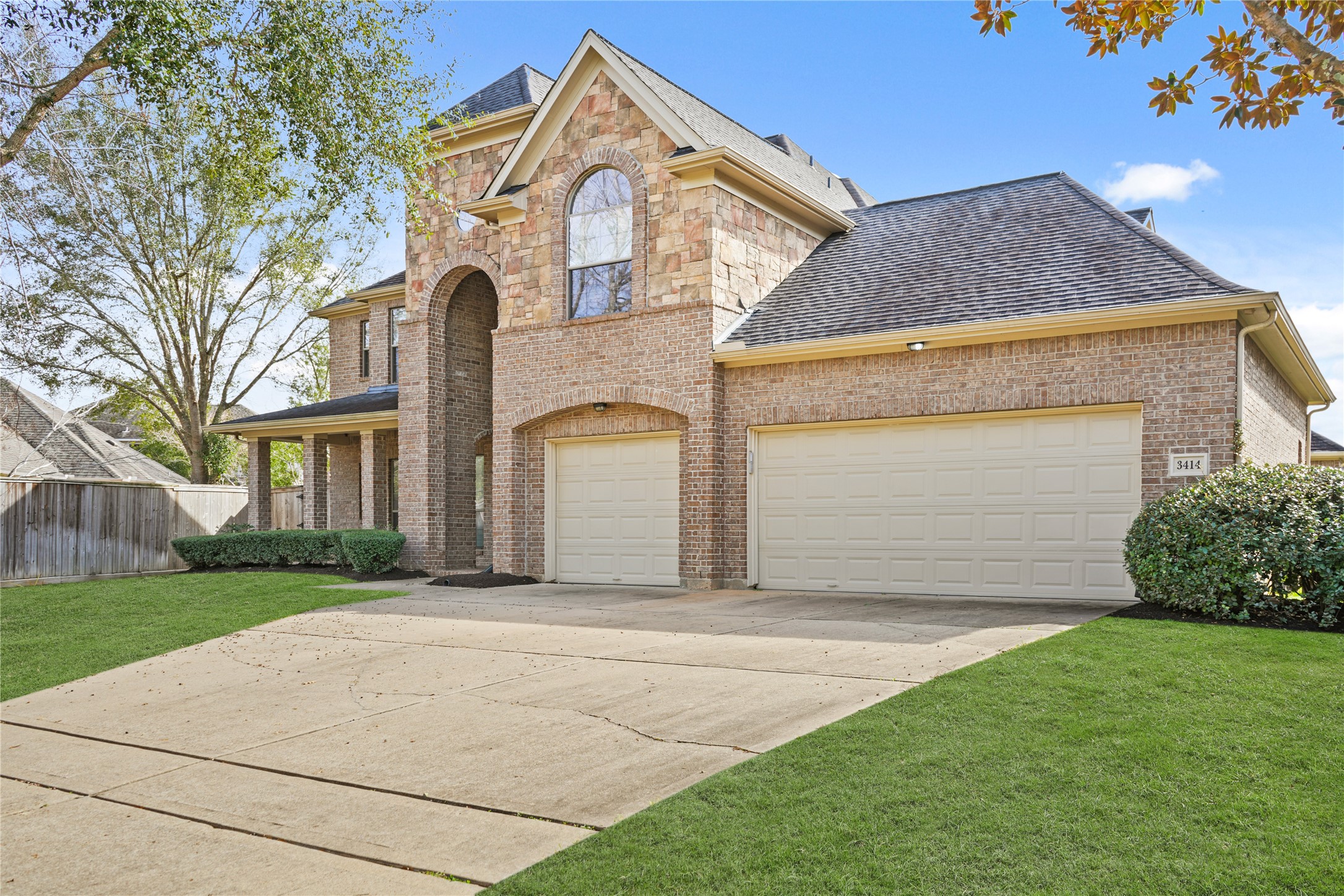 3414 Rue Orleans Missouri City, TX 77459 - Photo 2 of 46 a front view of a house with a garden and plants