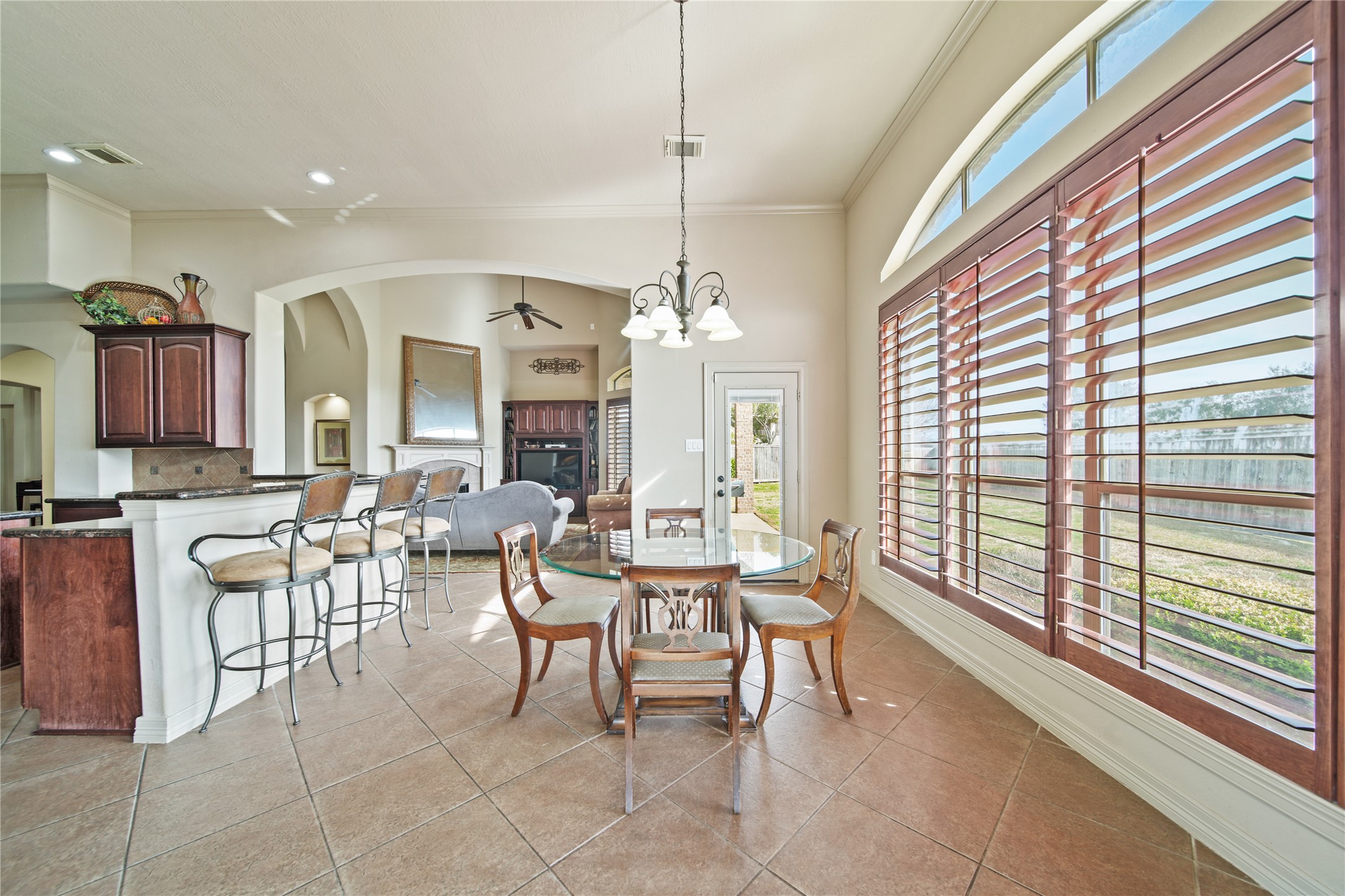 3414 Rue Orleans Missouri City, TX 77459 - Photo 23 of 46 a dining room with furniture a chandelier and window