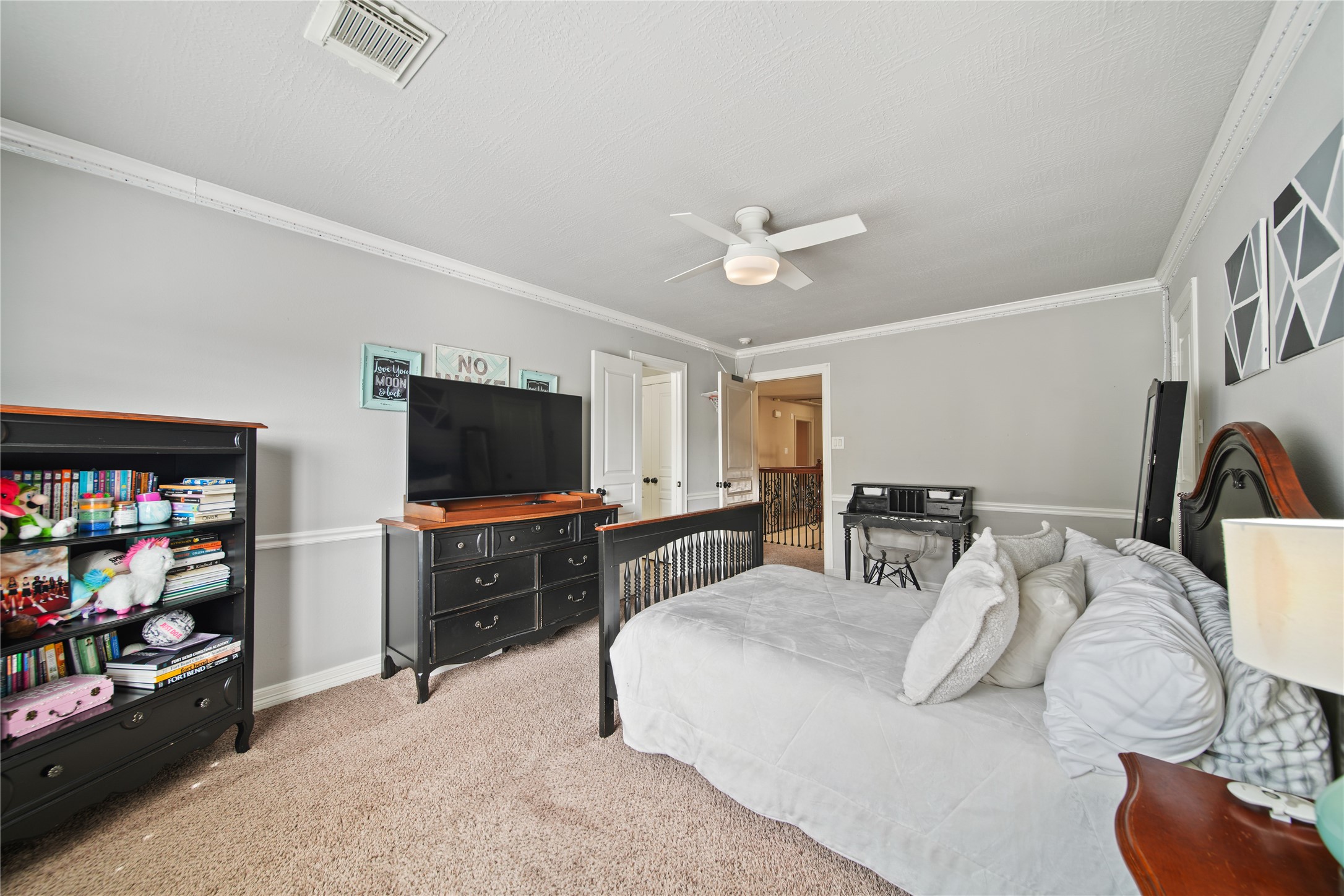 3414 Rue Orleans Missouri City, TX 77459 - Photo 36 of 46 a bedroom with furniture and a flat screen tv