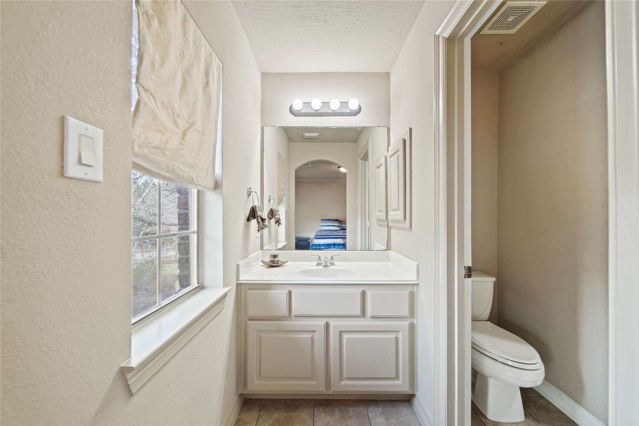 3414 Rue Orleans Missouri City, TX 77459 - Photo 39 of 46 a bathroom with a toilet a sink and a mirror
