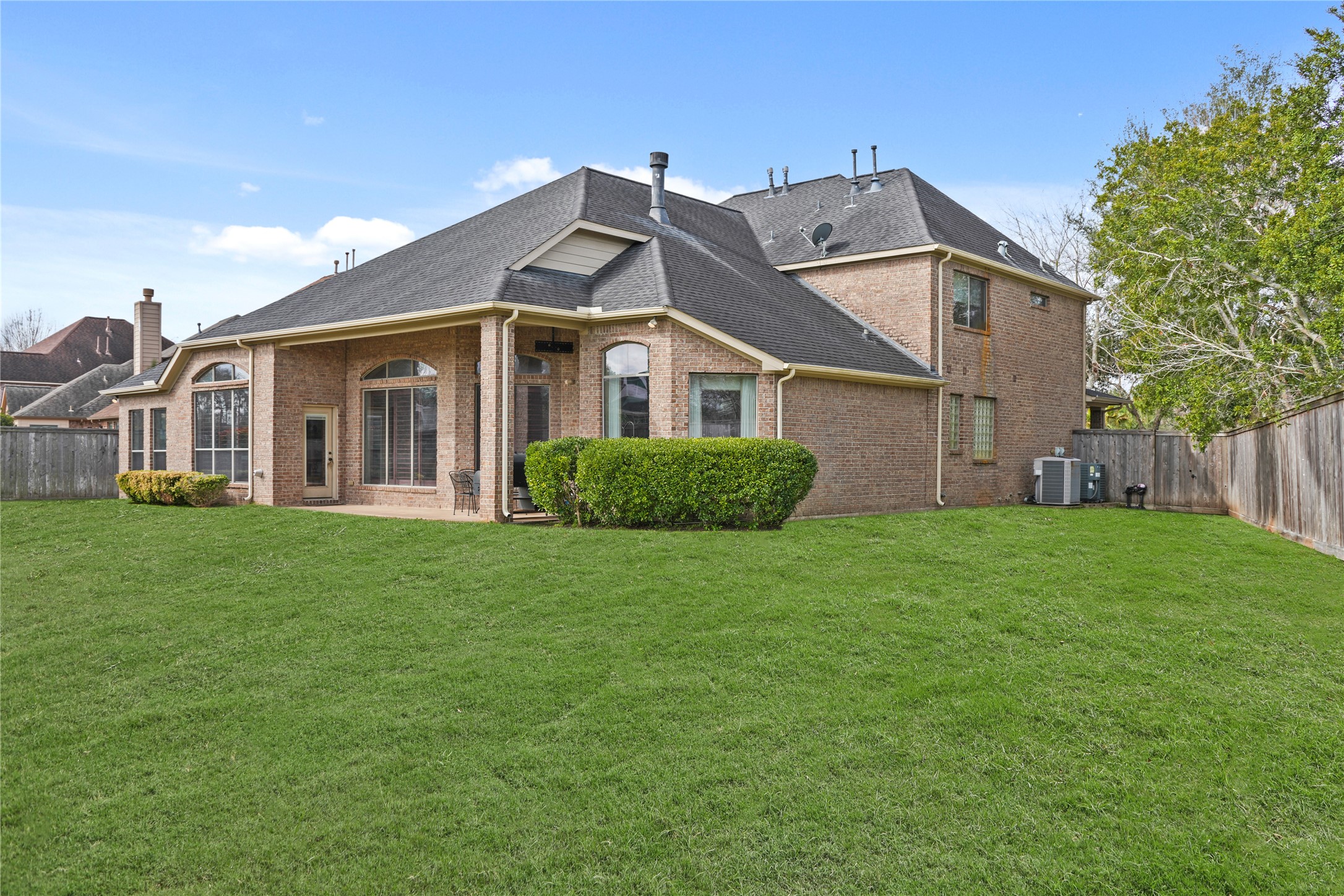 3414 Rue Orleans Missouri City, TX 77459 - Photo 45 of 46 a view of a house with a big yard potted plants and large tree