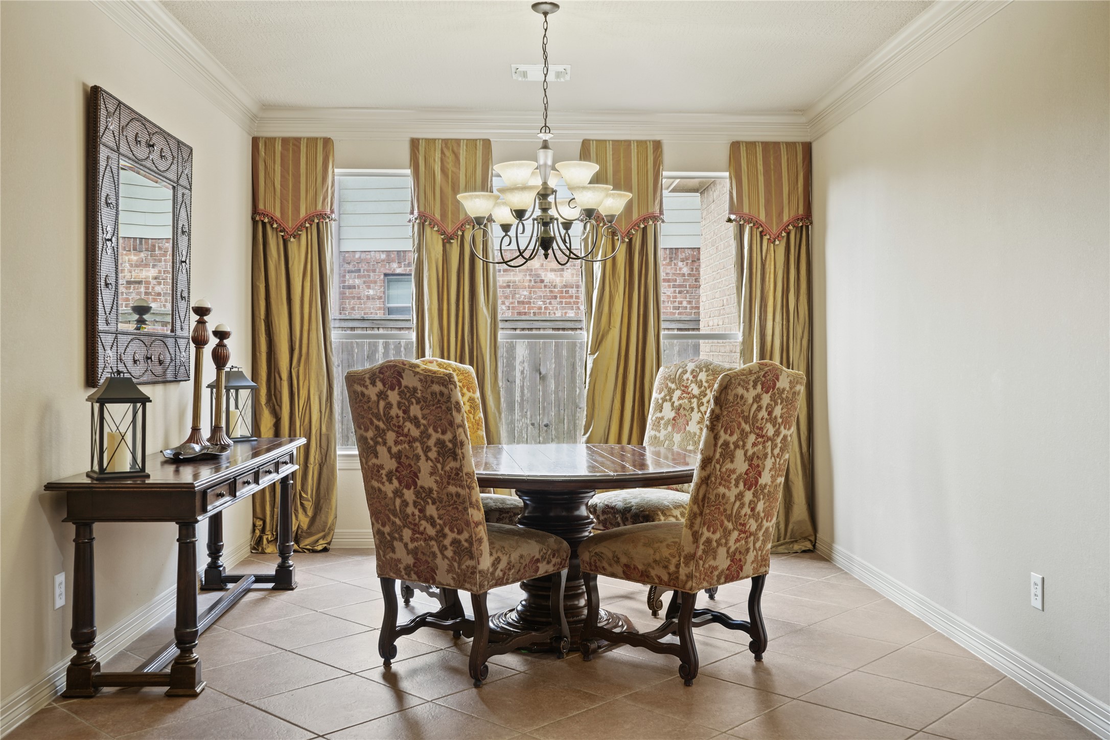 3414 Rue Orleans Missouri City, TX 77459 - Photo 10 of 46 a view of a dining room with furniture and a chandelier