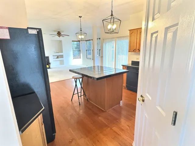 a view of a kitchen cabinets and wooden floor