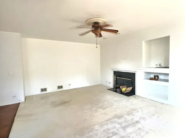 a view of a livingroom with a fireplace