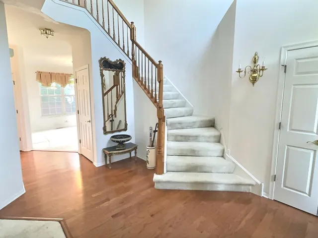 a view of an entryway with wooden floor