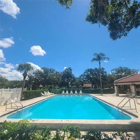 a view of a swimming pool with a lake view
