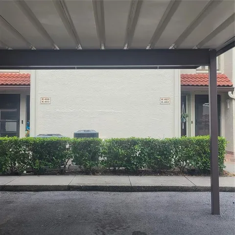 a couple of potted plants in front of door