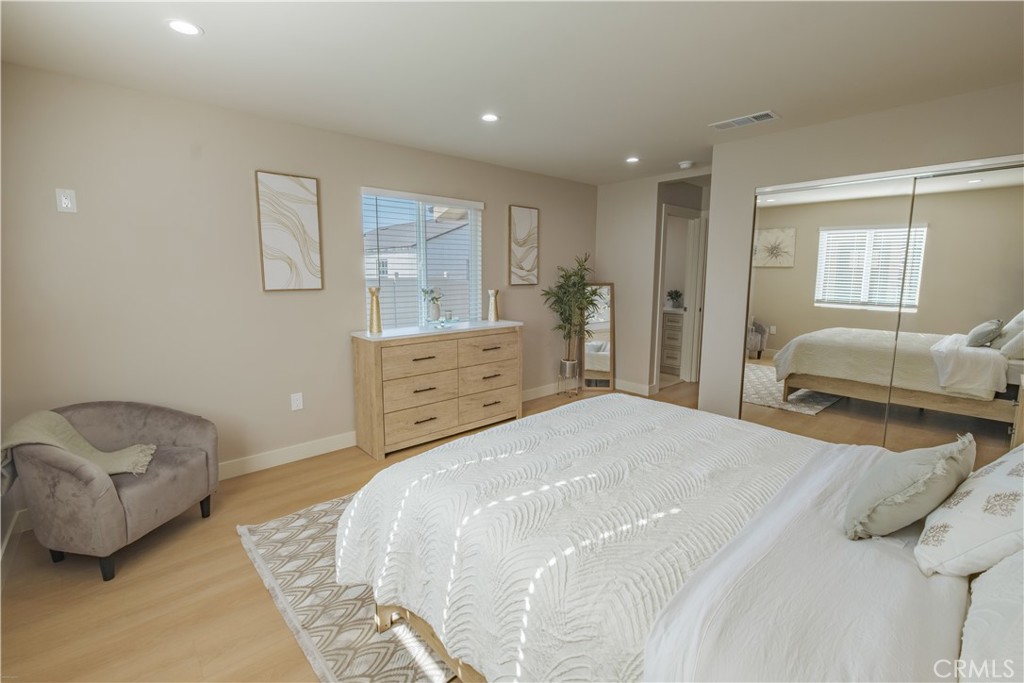 223 South Aprilia Avenue Compton, CA 90220 - Photo 26 of 46 a bedroom with a bed and window