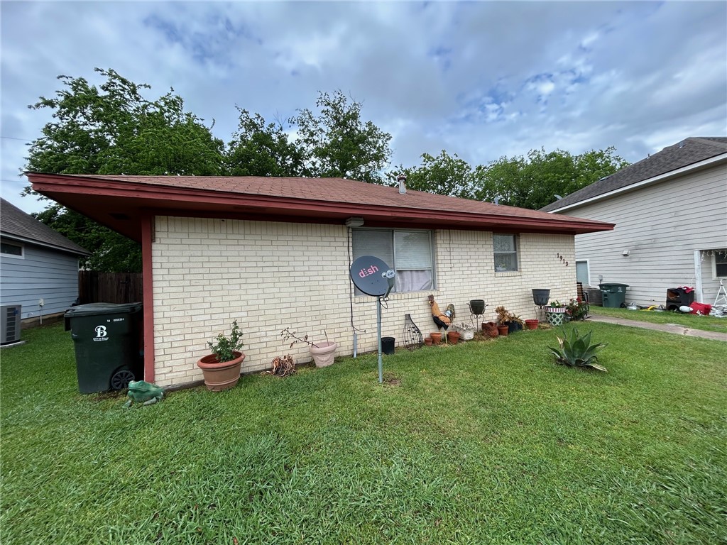 1913 Pine Tree Drive, Unit B Bryan, TX 77802 - Photo 1 of 13 a front view of a house with garden