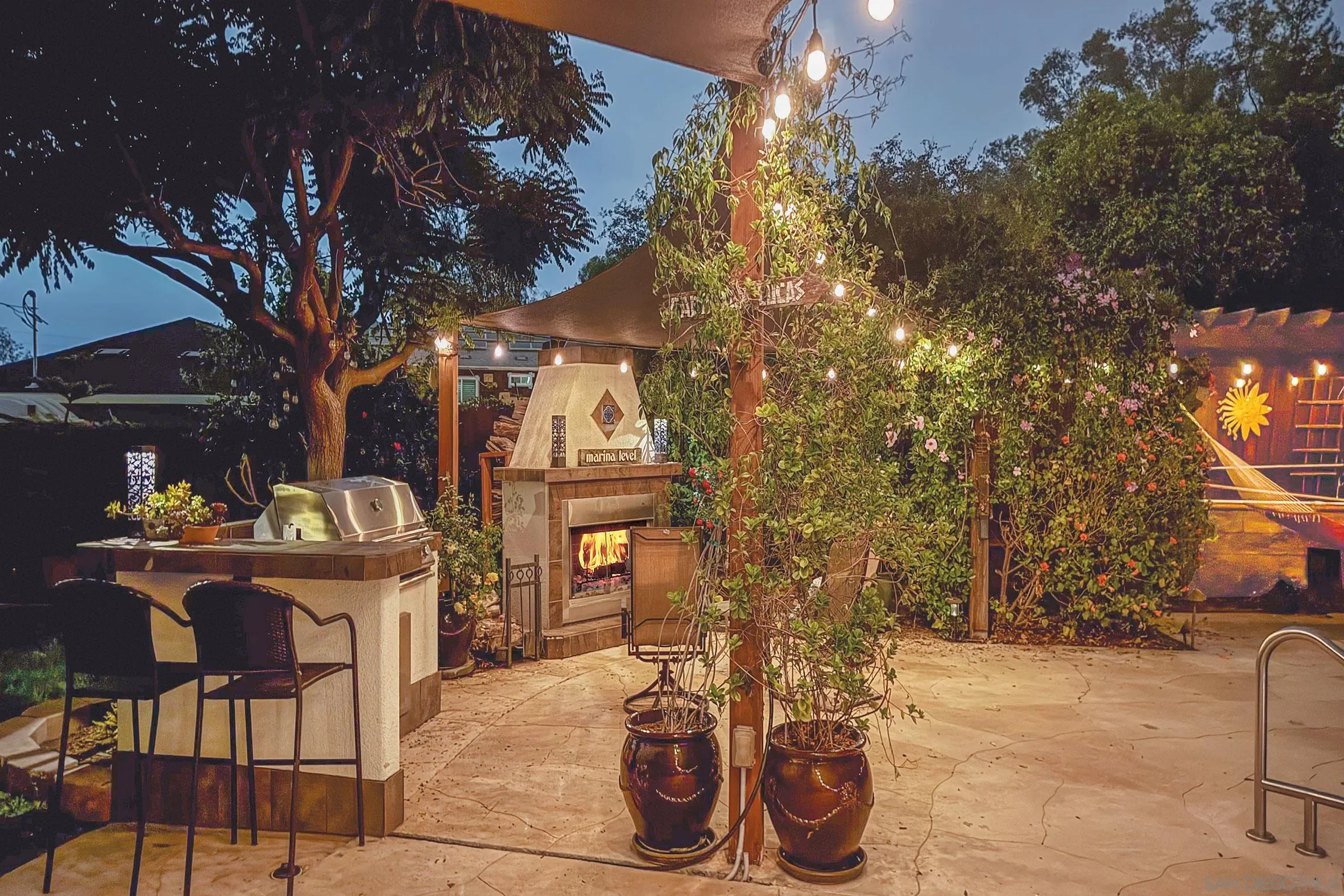 1996 Valley Rim Road El Cajon, CA 92019 - Photo 42 of 74 a view of a patio with table and chairs and potted plants
