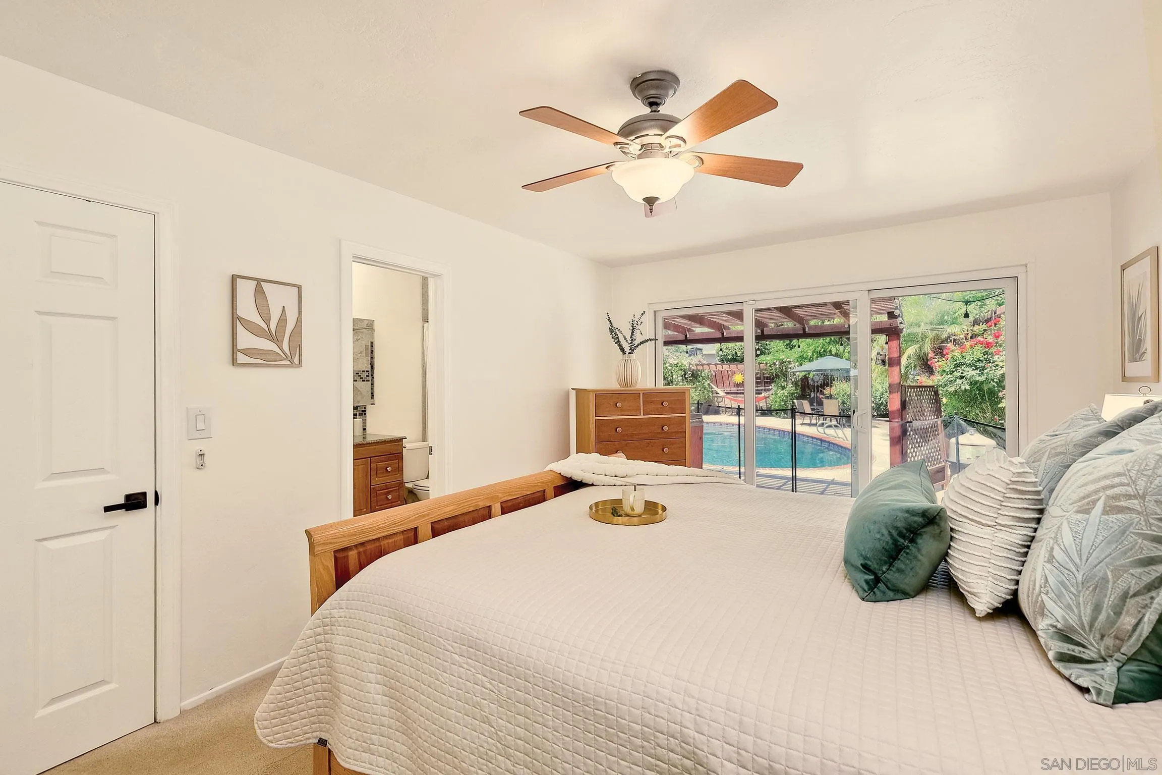 1996 Valley Rim Road El Cajon, CA 92019 - Photo 50 of 74 a bedroom with a large bed and a window