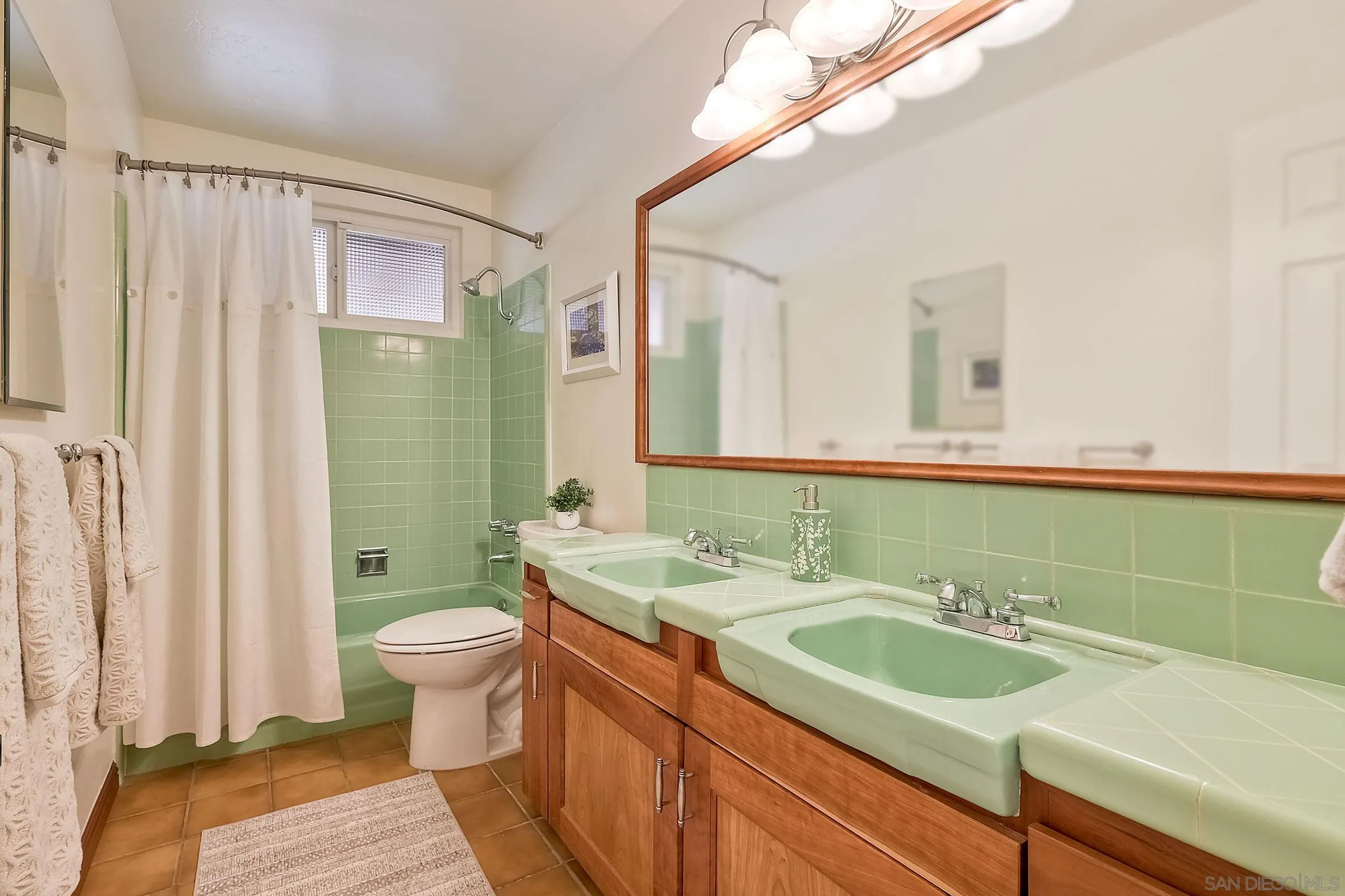1996 Valley Rim Road El Cajon, CA 92019 - Photo 51 of 74 a bathroom with a sink and a mirror