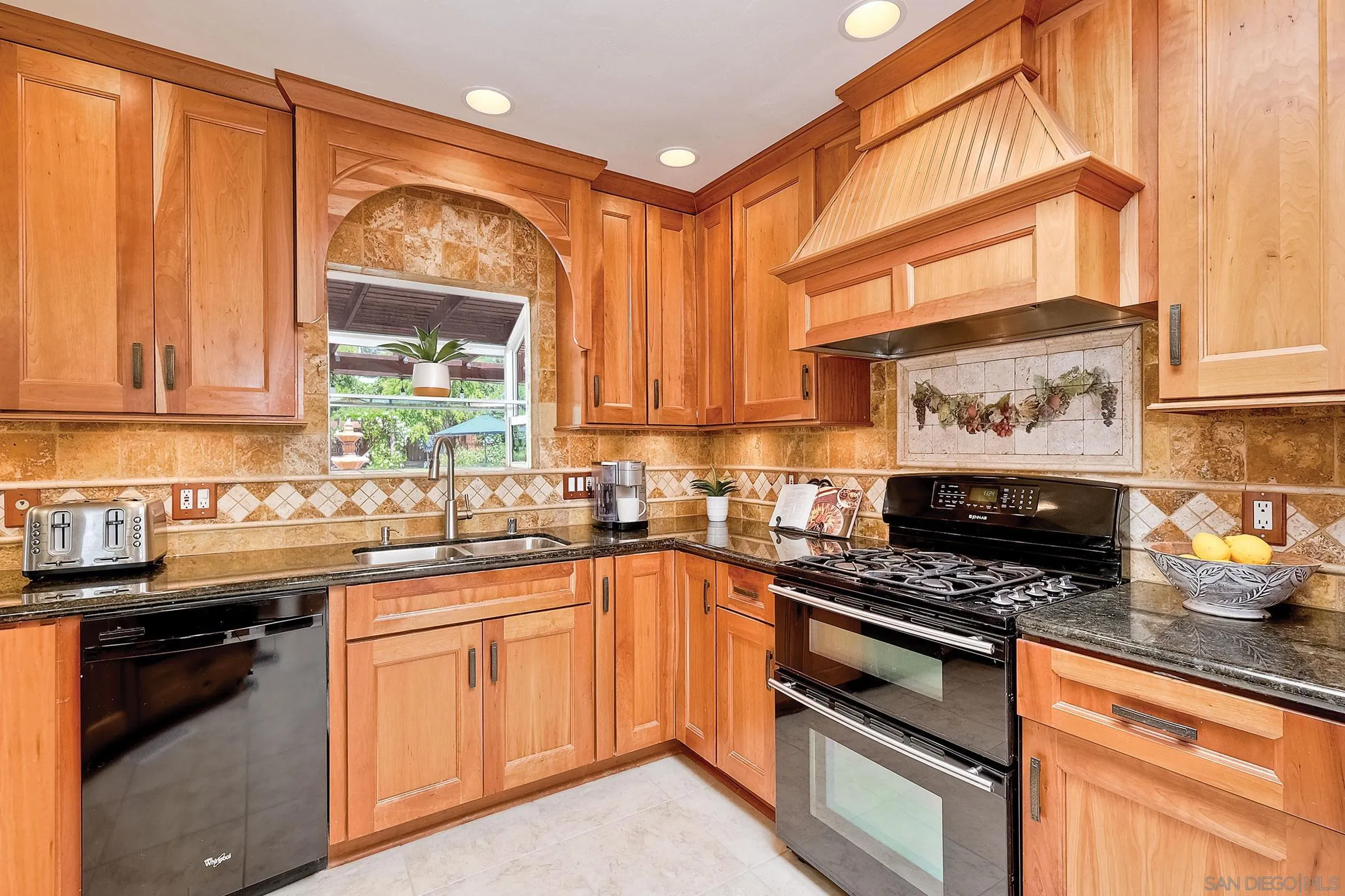 1996 Valley Rim Road El Cajon, CA 92019 - Photo 6 of 74 a kitchen with stainless steel appliances a stove sink and cabinets