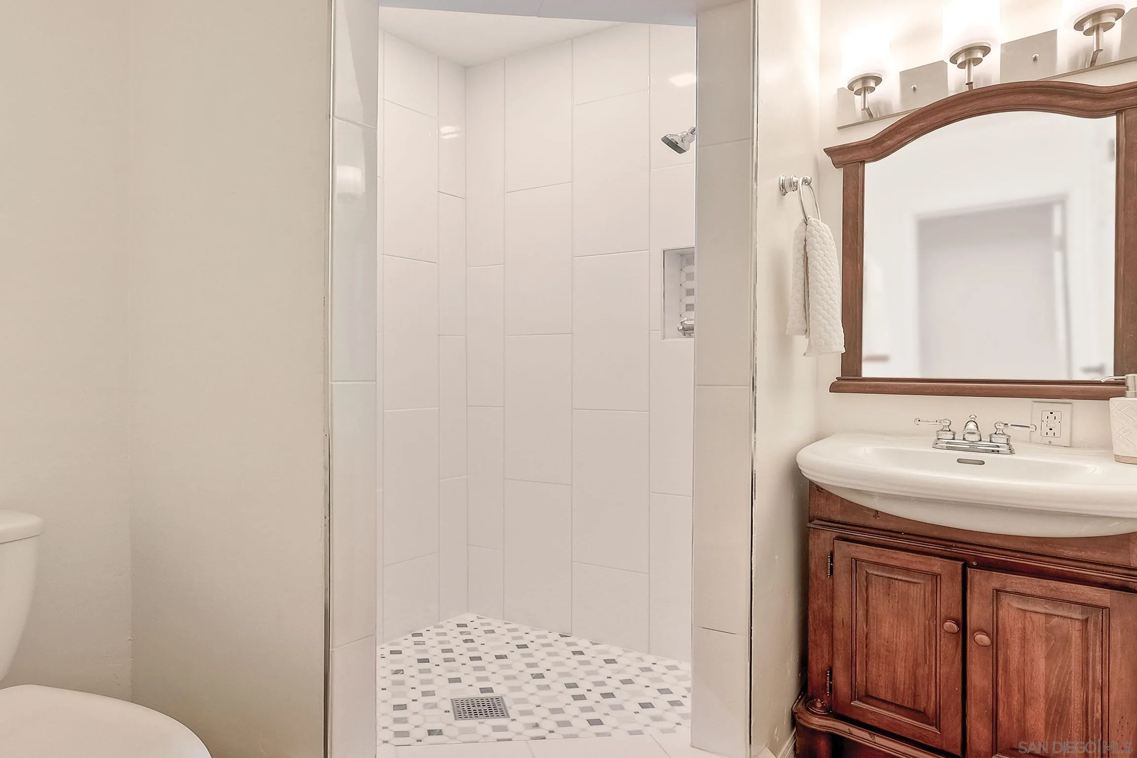 1996 Valley Rim Road El Cajon, CA 92019 - Photo 61 of 74 a bathroom with a sink and a mirror