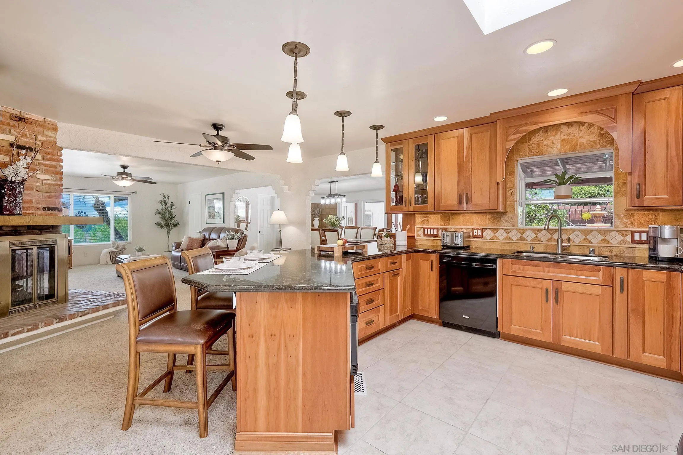 1996 Valley Rim Road El Cajon, CA 92019 - Photo 7 of 74 a kitchen with stainless steel appliances kitchen island granite countertop a sink and cabinets