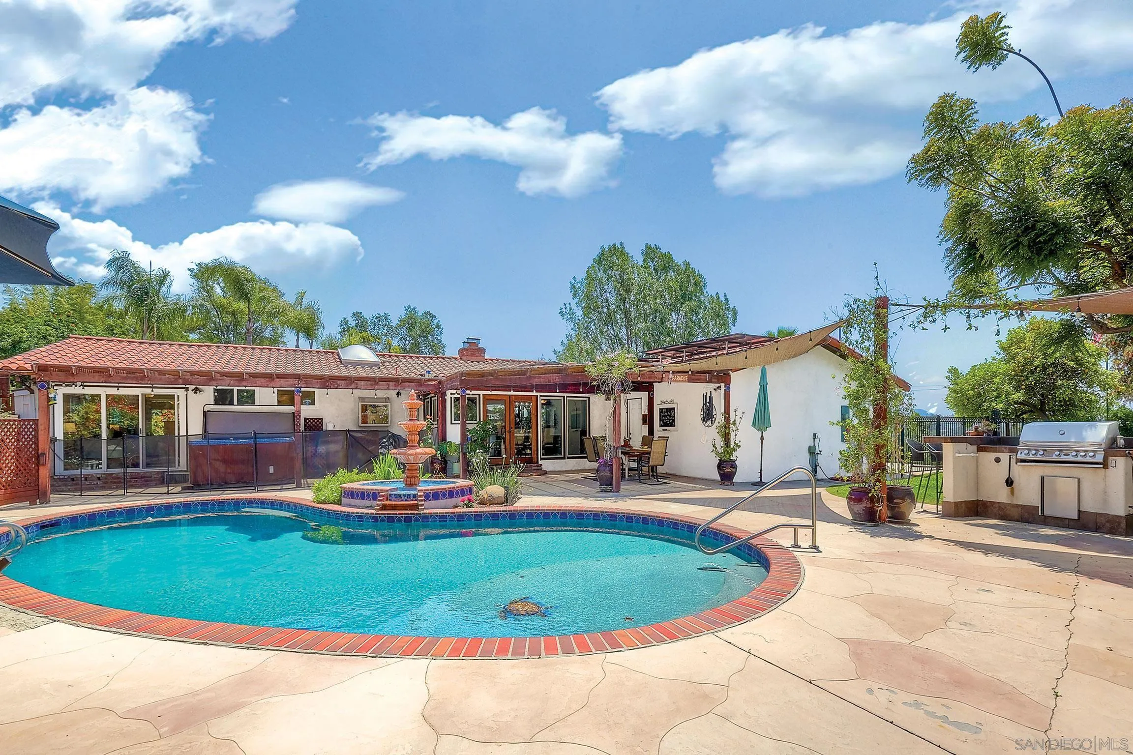 1996 Valley Rim Road El Cajon, CA 92019 - Photo 73 of 74 a view of a house with a backyard porch and sitting area