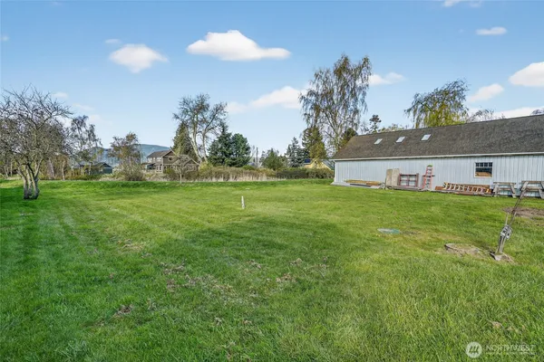 a view of a house with a big yard