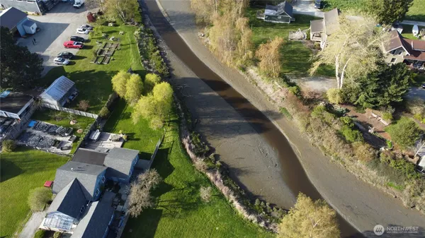 an aerial view of residential house with outdoor space and swimming pool