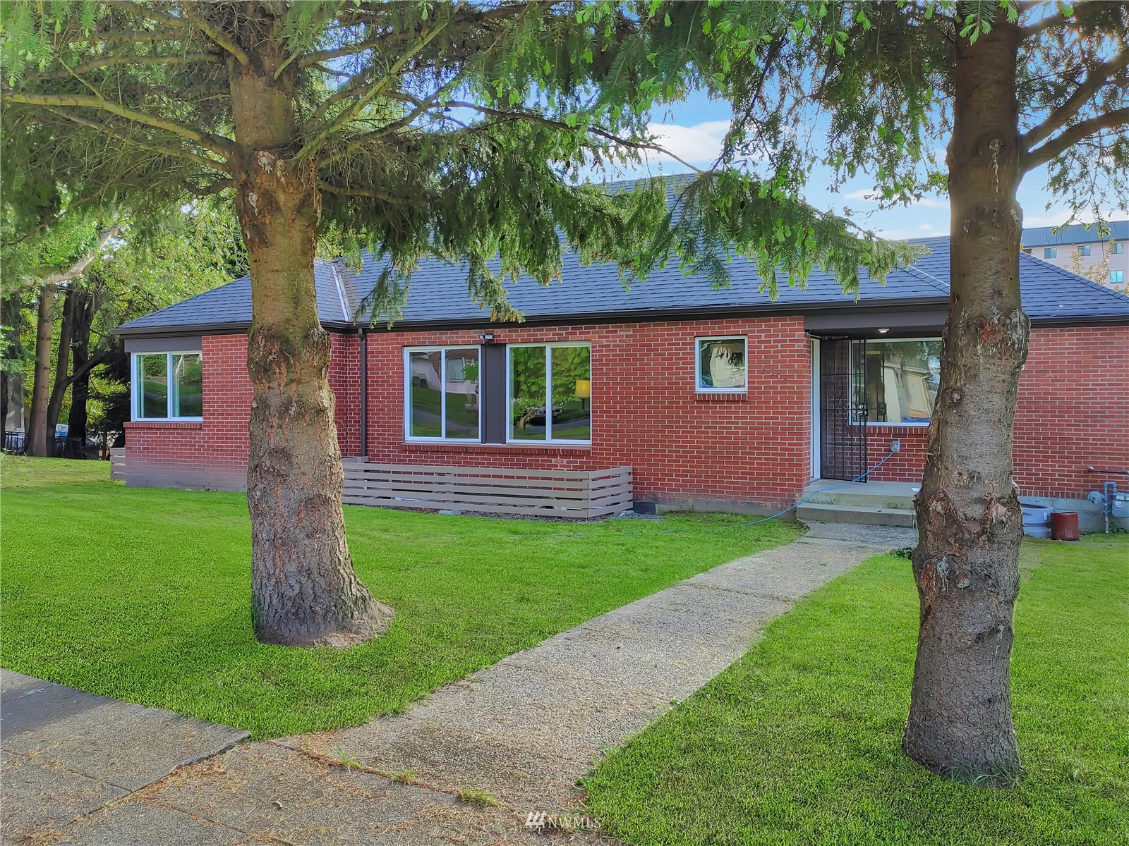 3506 Rockefeller Avenue Everett, WA 98201 - Photo 1 of 27 a front view of a house with a garden and yard