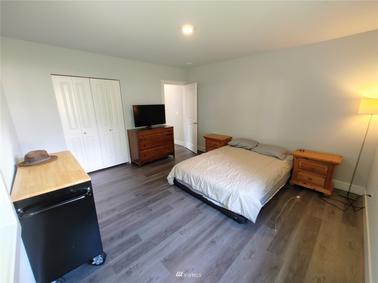 3506 Rockefeller Avenue Everett, WA 98201 - Photo 15 of 27 a bedroom with a bed and wooden floor